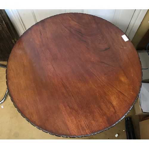 48 - A Edwardian circular mahogany occasional table with carved patterned edge 73h x 65cm d.