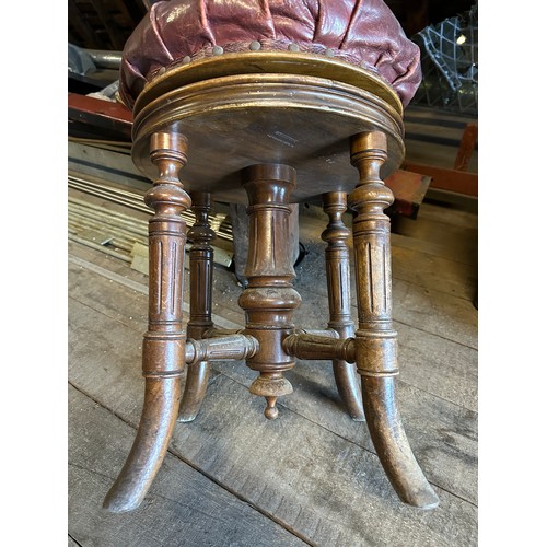 162 - A 19thC adjustable swivel topped stool with red leather top, maker H. Brooks and Co. Ltd. 7220/133, ... 