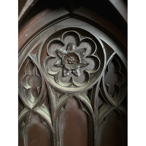 165 - The vicar’s stall ex Beverley Minster,  heavily carved in oak with gothic arches and Yorkshire rose,... 