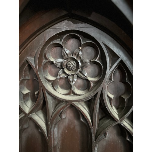 165 - The vicar’s stall ex Beverley Minster,  heavily carved in oak with gothic arches and Yorkshire rose,... 