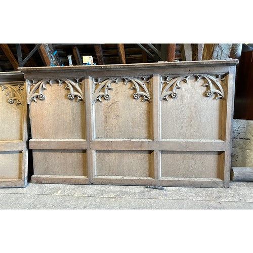 171 - Two carved oak panels, pew fronts, sloping shelf to top, each panel 141cm w approx. X 84cm h with sp... 