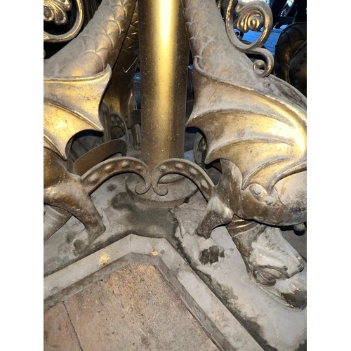 176 - Two very good quality 19thC ornate brass gas light fittings, the base surrounded by four sea wyverns... 