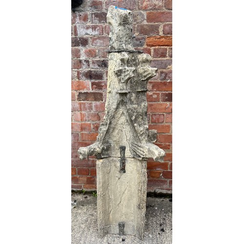 200 - A two piece Tadcaster stone pinnacle dating from the 1300’s with three grotesques and leadwork fixin... 