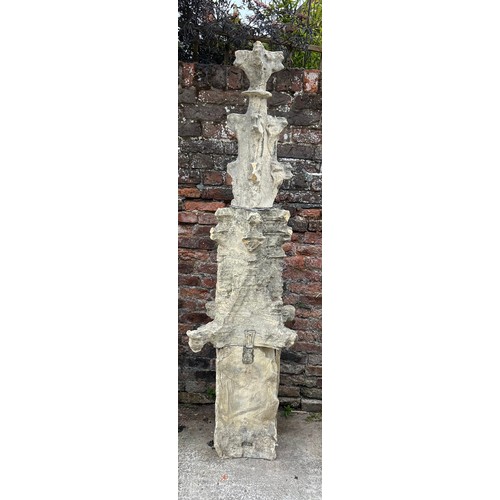 205 - A three piece Tadcaster stone pinnacle dating to the 1300’s with four grotesques and lead fixings. F... 