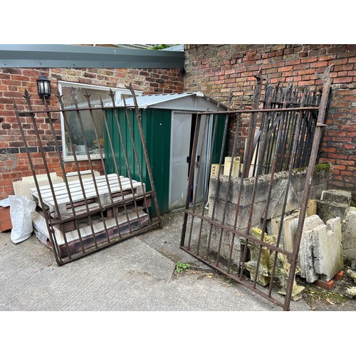 184 - A pair of 19thC iron gates from Beverley Minster, possibly the East End. 280cm w x 197cm h.