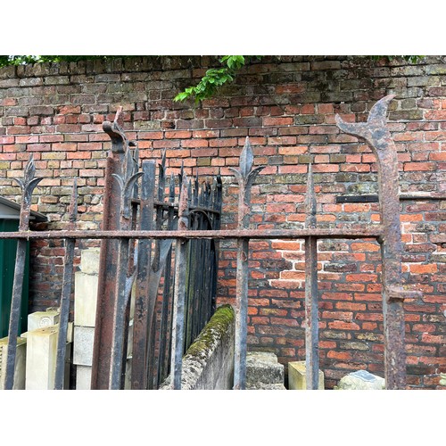 184 - A pair of 19thC iron gates from Beverley Minster, possibly the East End. 280cm w x 197cm h.