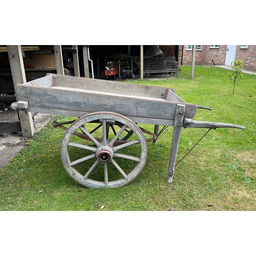 182 - A 19thC hand cart with wooden wheels and steel rims and suspension. Originally used to transport sca... 