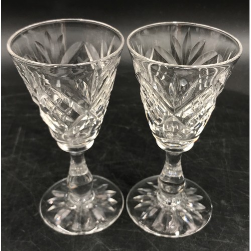 49 - A collection of glasses to include 6x brandy glasses with etched design, 5x sherry glasses with etch... 