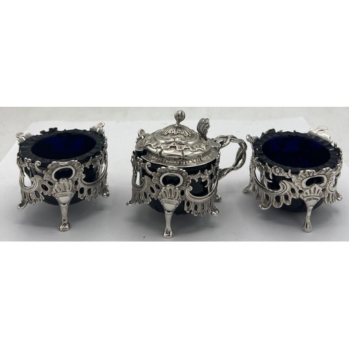 60 - A pair of silver salts and a mustard pot Birmingham 1838/39, maker Joseph Wilmore. All with blue gla... 