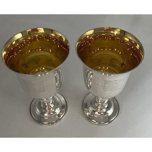 68 - A boxed pair of Barker Ellis silver goblets Birmingham 1973, numbers 254 and 255 of a limited editio... 