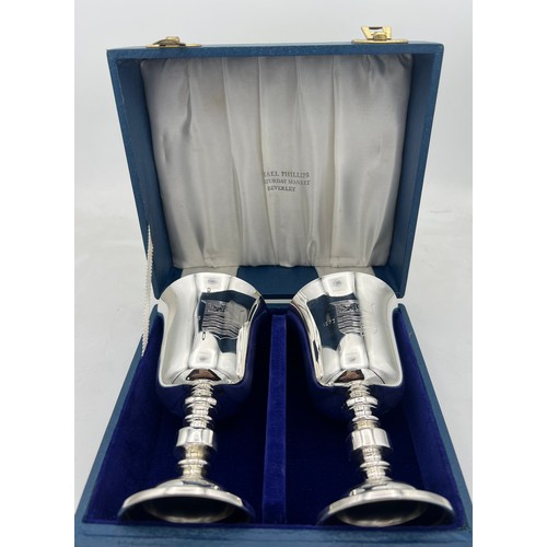 68 - A boxed pair of Barker Ellis silver goblets Birmingham 1973, numbers 254 and 255 of a limited editio... 