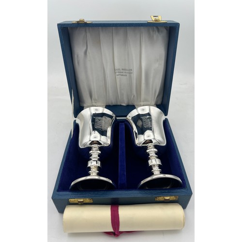 68 - A boxed pair of Barker Ellis silver goblets Birmingham 1973, numbers 254 and 255 of a limited editio... 