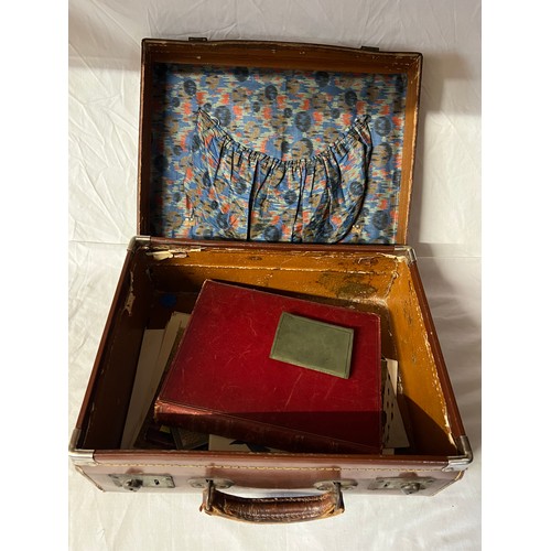 80 - A vintage suitcase and miscellaneous contents to include Gallery of Engravings, The Battle of Life, ... 