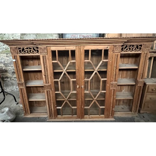 2 - A large pine dresser, 4 doors to base, 2 glazed doors to centre, top with shelves to each side. 219 ... 