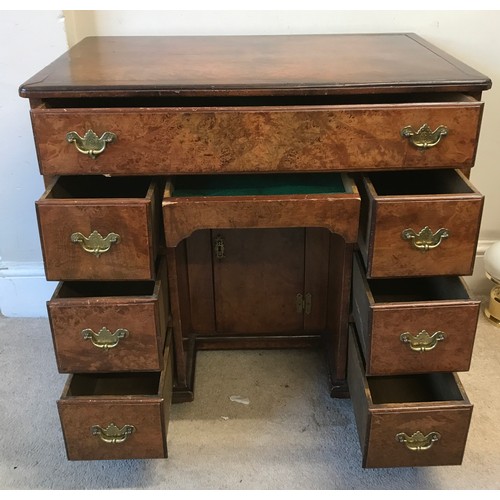 3 - A 20thC burr walnut kneehole desk of small proportions 78w x 49d x 74cm h.