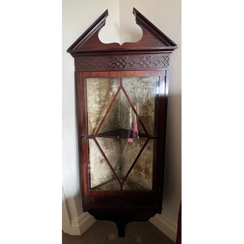 5 - An Edwardian mahogany corner cupboard with single glazed door and velvet lined interior 132h x 40w x... 