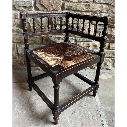 12 - A 19thC rush seated corner chair 84h x 40w x 42cm d along with an oak spinning chair.