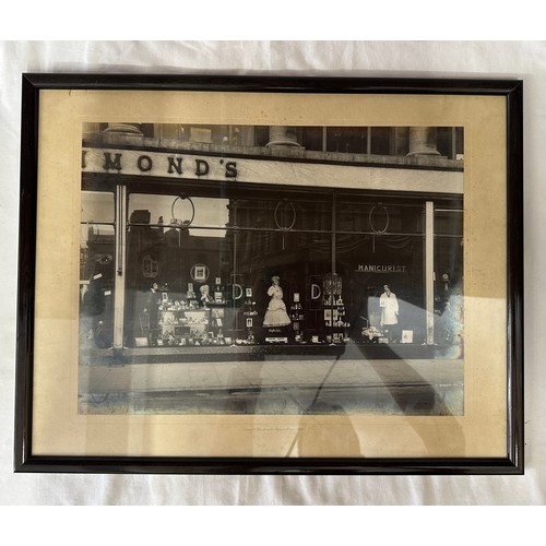 1277 - A pair of two framed photographs of Hammonds shop fronts one saying 