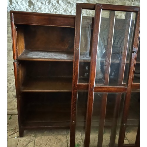 34 - A three height Globe Wernicke style oak bookcase. 116 h x 128 w x 31cm d.