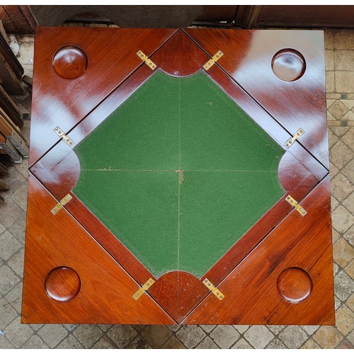 37 - An Edwardian mahogany envelope card table with drawer to front and green baize and four recessed hol... 