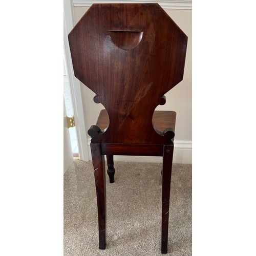 42 - A 19thC mahogany hall chair, 82cm h