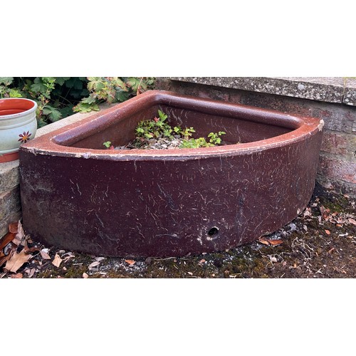 1350 - Two 19thC treacle glazed corner feeding troughs. 60cm x 60 x 58.