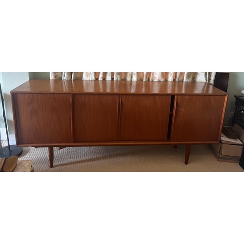 49 - A teak sideboard by Axel Christensen for Aco Møbler, Danish, mid century. Four sliding doors to fron... 