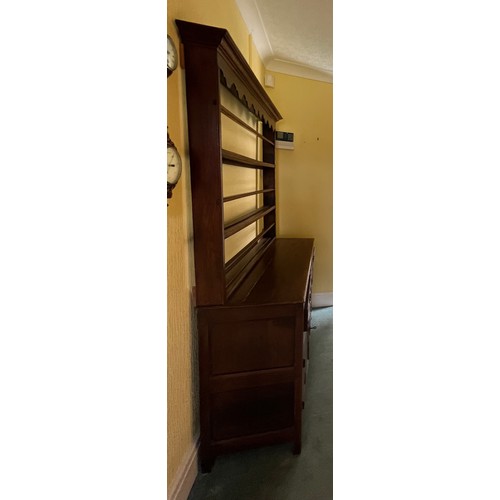 51 - An 18thC oak dresser comprising four drawers and one cupboard with rack to back. 125cm w x 45d x 190... 