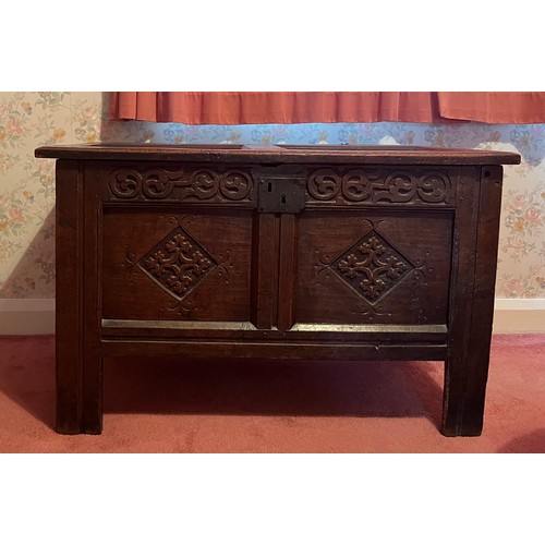 54 - An early 18thC 0ak kist with original carving, snipe hinges and candle box to interior. 96cm w x 46.... 