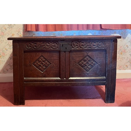 54 - An early 18thC 0ak kist with original carving, snipe hinges and candle box to interior. 96cm w x 46.... 