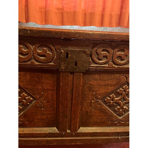 54 - An early 18thC 0ak kist with original carving, snipe hinges and candle box to interior. 96cm w x 46.... 