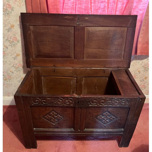 54 - An early 18thC 0ak kist with original carving, snipe hinges and candle box to interior. 96cm w x 46.... 