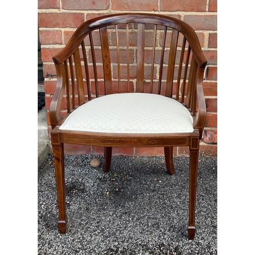 57 - An Edwardian mahogany and inlaid armchair with upholstered seat.