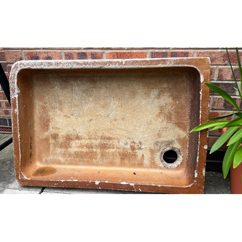 1352 - A 19thC treacle glazed sink. 92cm w x 61cm d x 14cm h.