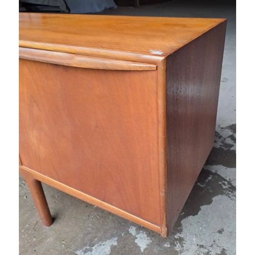 64 - A mid 20thC AH McIntosh Ltd teak sideboard. Three drawers and three cupboards. 213cm l x 45cm d x 75... 