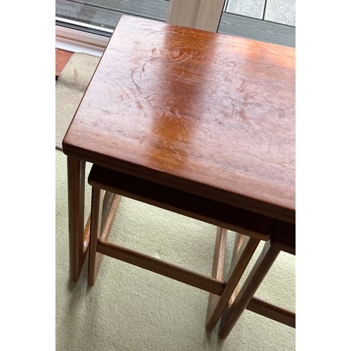 66 - A mid 20thC McIntosh teak nest of three tables. The largest of which turns and opens to 74cm x 81cm ... 