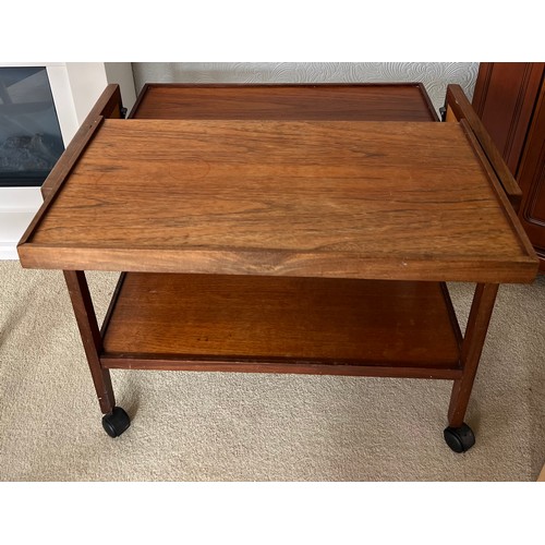 67 - A metamorphic rosewood tea trolley. With top extended measures 76cm x 71cm x 68cm h.