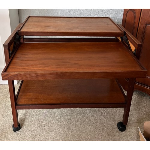 67 - A metamorphic rosewood tea trolley. With top extended measures 76cm x 71cm x 68cm h.