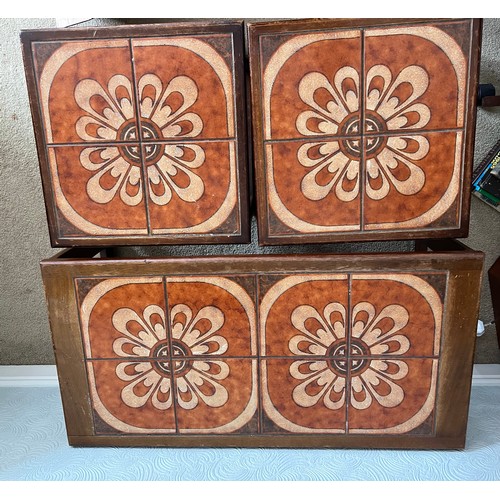 68 - A nest of three mid 20thC tile topped tables. Largest 96cm x 48cm x 40cm h.