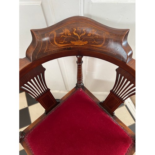 70 - An Edwardian mahogany and inlaid corner chair. Art Nouveau decoration to top rail.