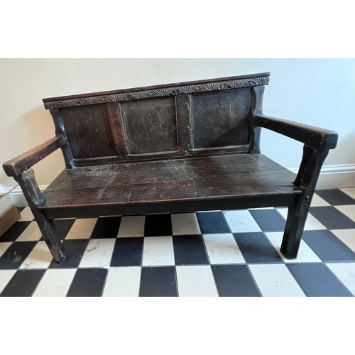 71 - A mainly 18thC oak settle. With fitted cushion in hunting pattern. 116cm w x 74cm w. Height to seat ... 