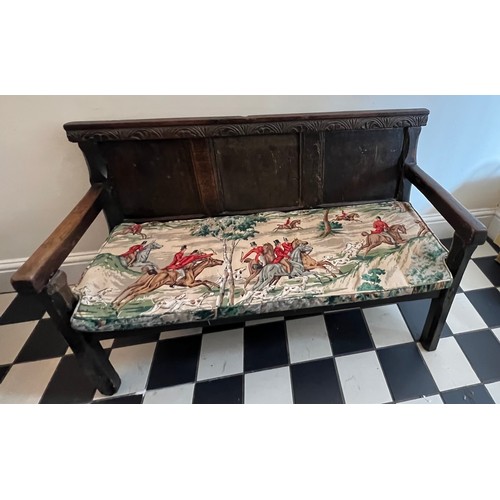 71 - A mainly 18thC oak settle. With fitted cushion in hunting pattern. 116cm w x 74cm w. Height to seat ... 