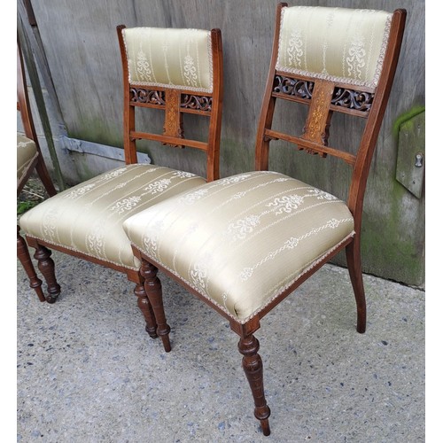 73 - Three Edwardian rosewood and inlaid chairs, a pair and one single nursing chair.