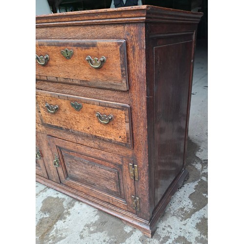 74 - A Georgian oak dresser base with cross banding to drawers and brass handles. 135cm w 52cms d x 93cm ... 