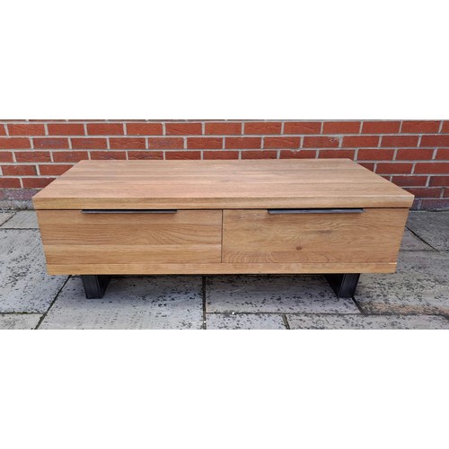 76 - An oak coffee table with two drawers to the front. 43cm h x 120cm w x 60cm d.