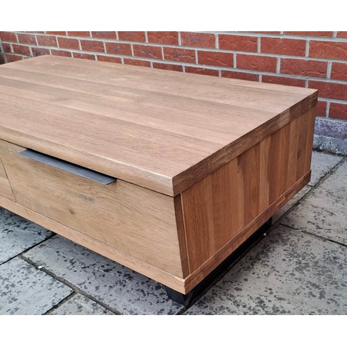 76 - An oak coffee table with two drawers to the front. 43cm h x 120cm w x 60cm d.