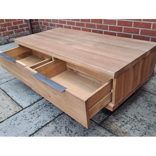 76 - An oak coffee table with two drawers to the front. 43cm h x 120cm w x 60cm d.