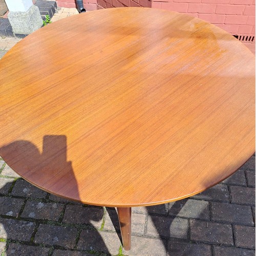 77 - A mid 20th Century teak oval extending dining table by McIntosh. 75cm h x 168cm open/122cm closed x ... 