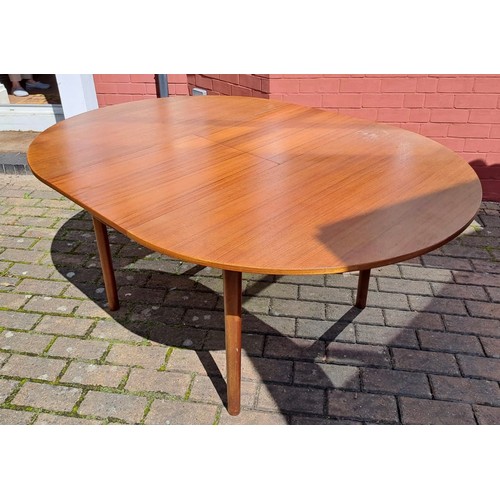 77 - A mid 20th Century teak oval extending dining table by McIntosh. 75cm h x 168cm open/122cm closed x ... 