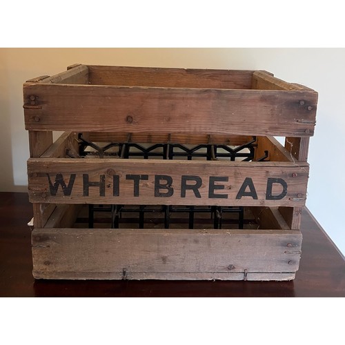 1255 - A vintage wooden Whitbread beer crate. 39cm x 28cm.